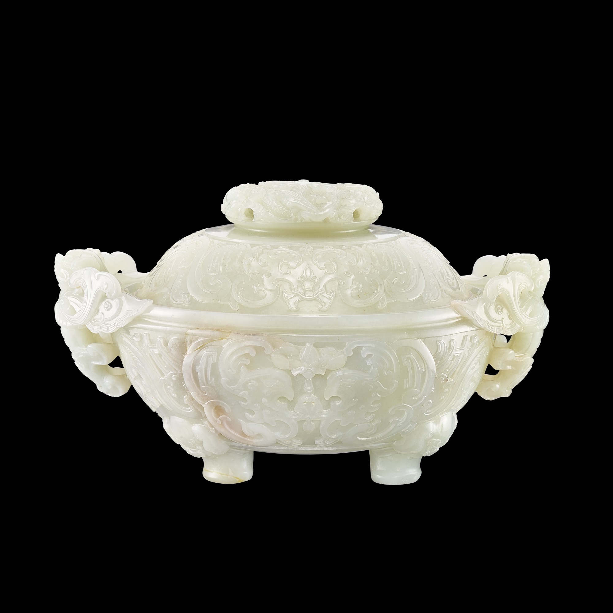 A finely carved white jade 'dragon and phoenix' tripod incense burner