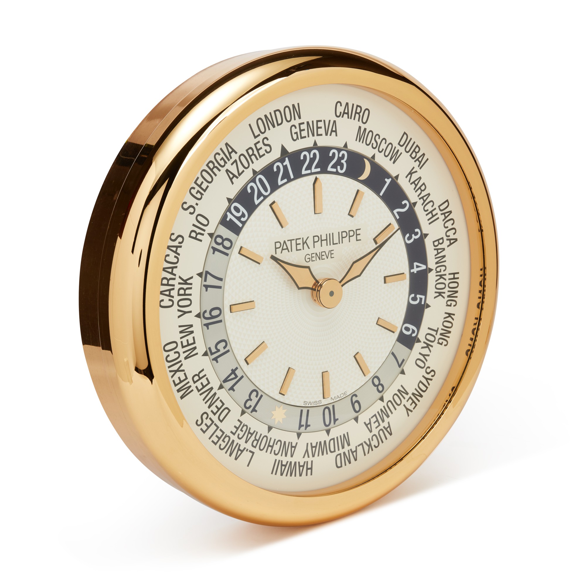 A large gilt brass wall clock with world time dial, Circa 2000 百達翡麗 大型鍍金銅掛鐘，配世界時間錶盤，約2000年製