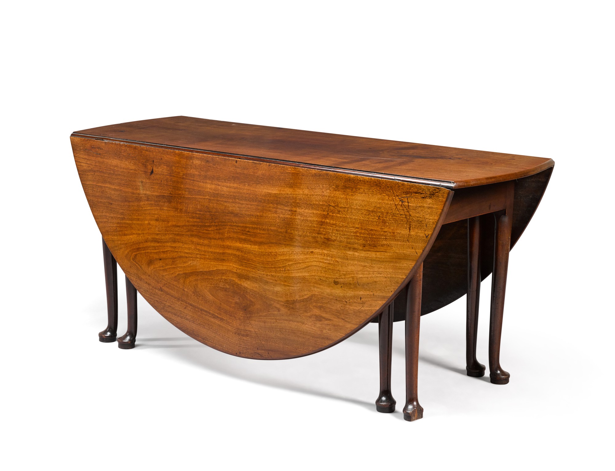 A George II oval mahogany twin-gateleg table, mid-18th century ...