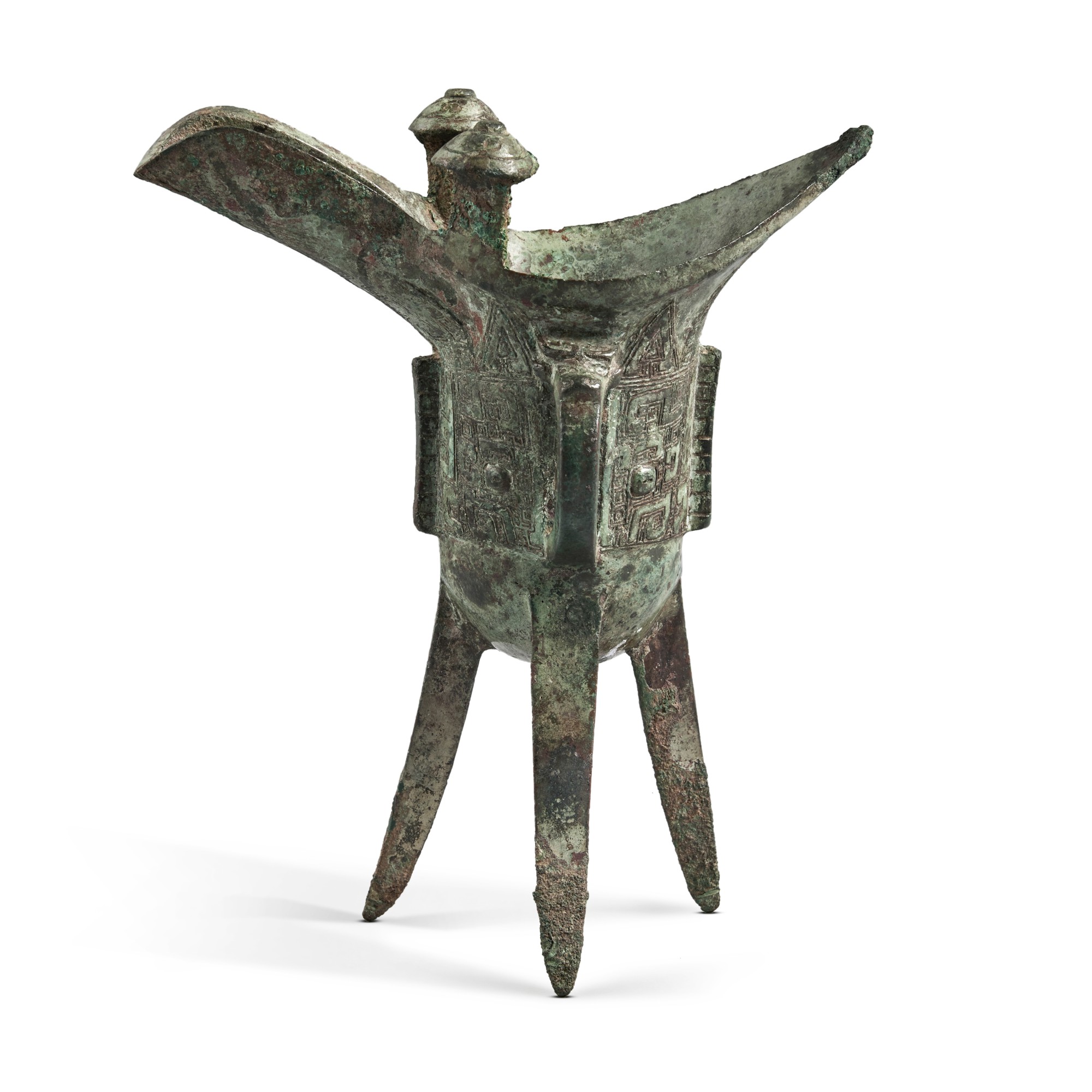 An inscribed archaic bronze ritual wine vessel (Jue), Late Shang ...