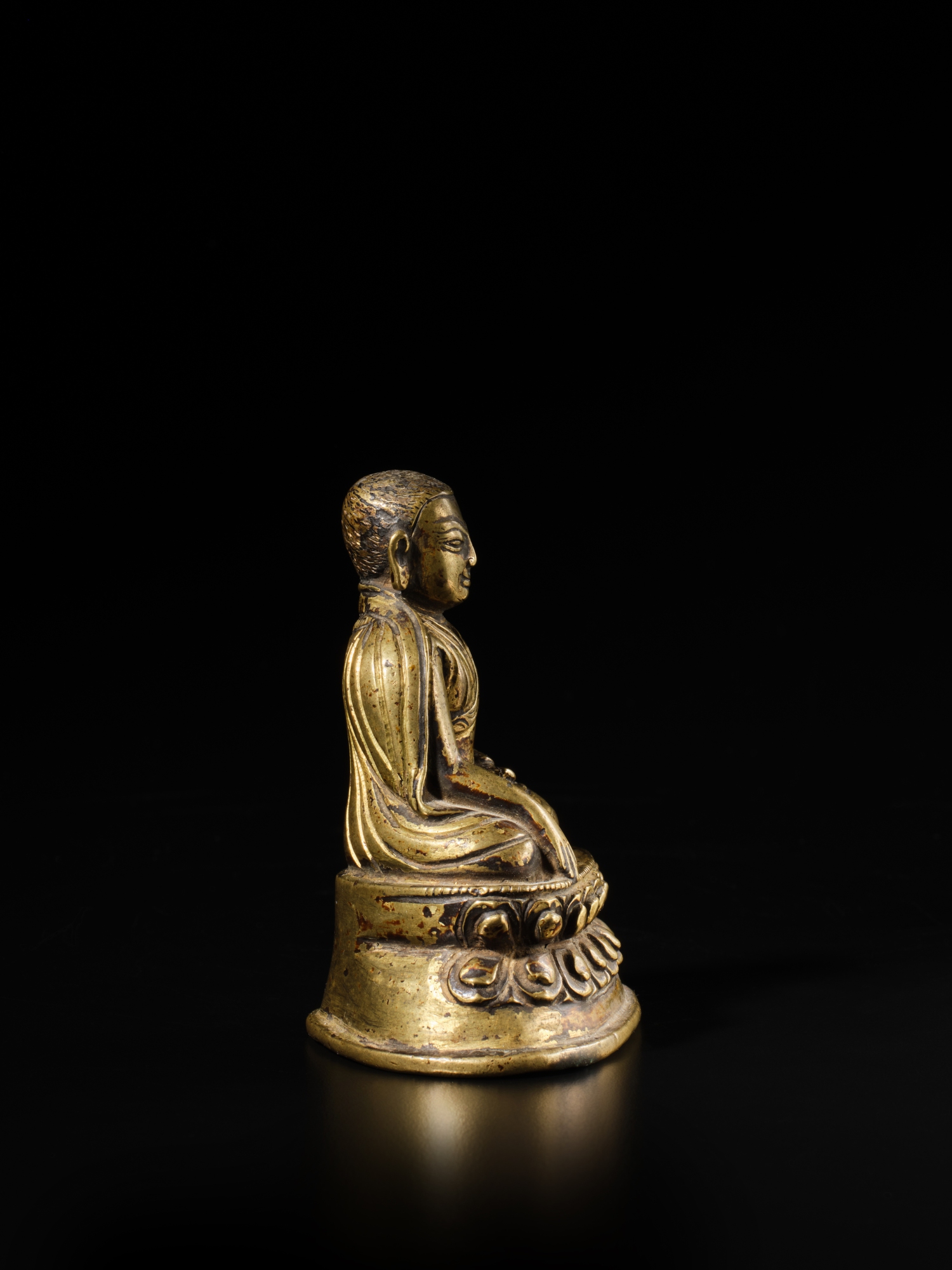 An inscribed copper alloy figure of Cohje Lorepa, Tibet, 14th century