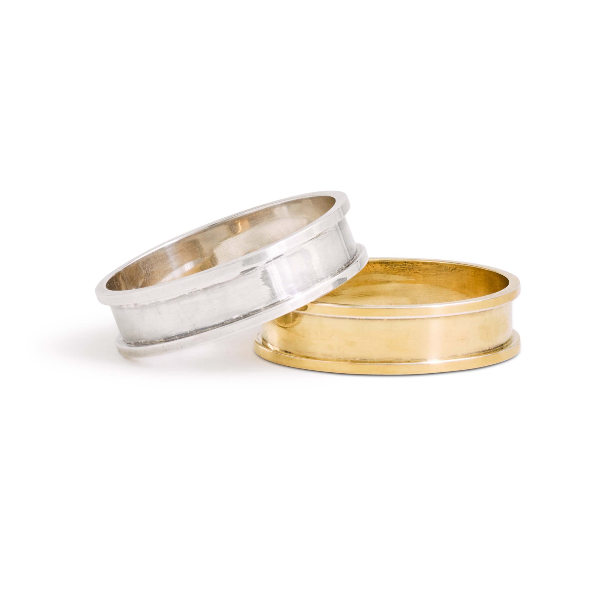 Hermès a cased pair of silver and silvergilt napkin rings, Hermès