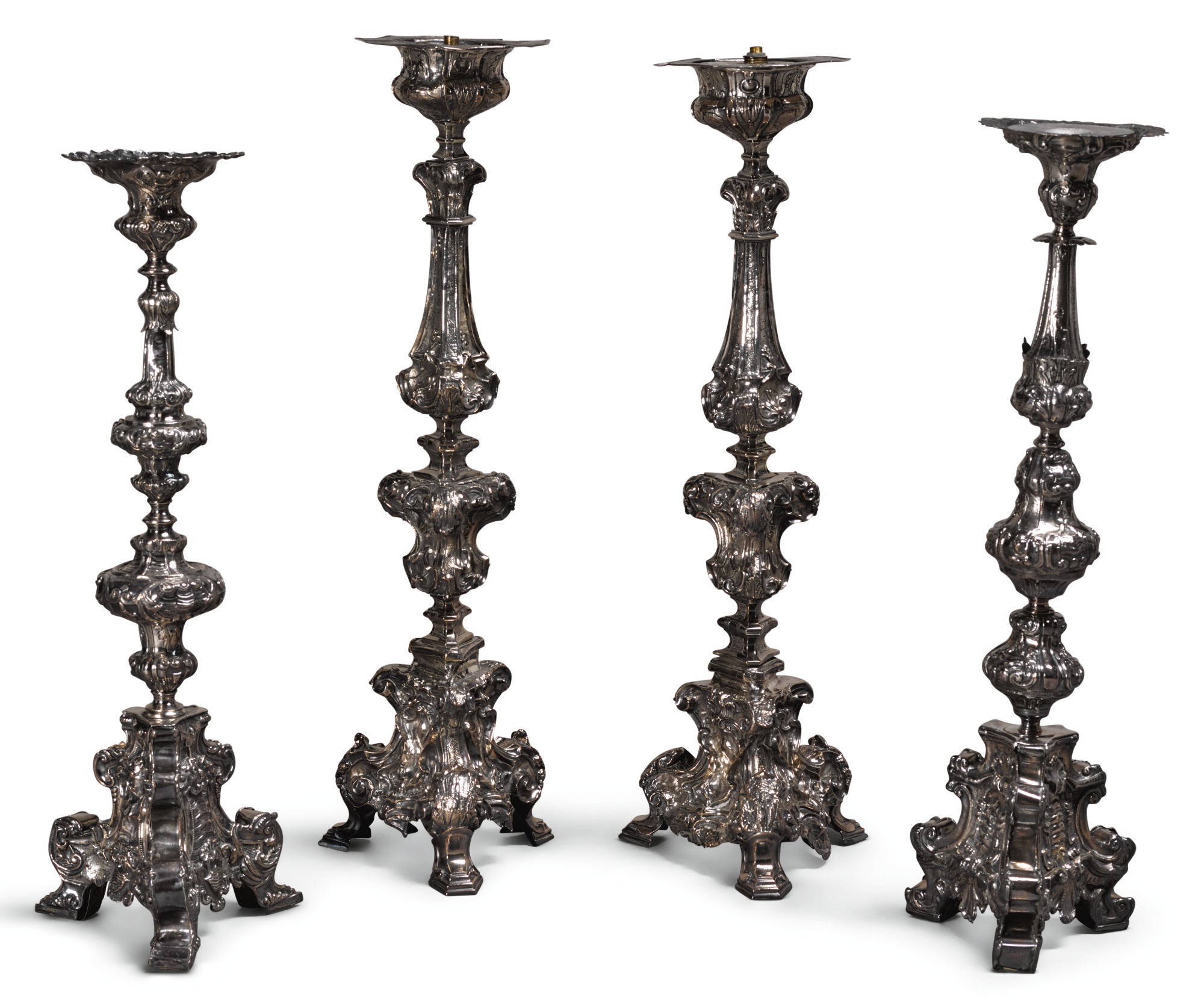 TWO SIMILAR PAIRS OF BAROQUE SILVER ALTAR CANDLESTICKS, PROBABLY