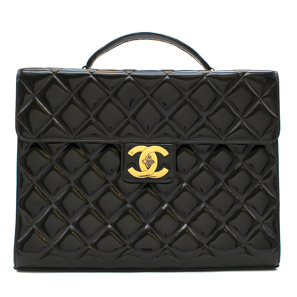 Black vintage briefcase in patent leather with gold hardware. Chanel
