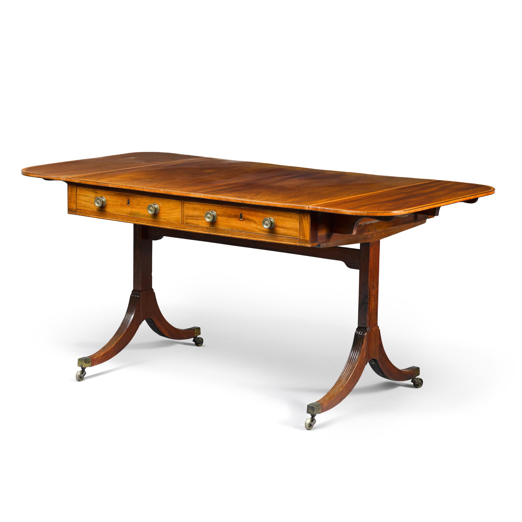 A Regency boxwood and ebony strung mahogany sofa table, early 19th