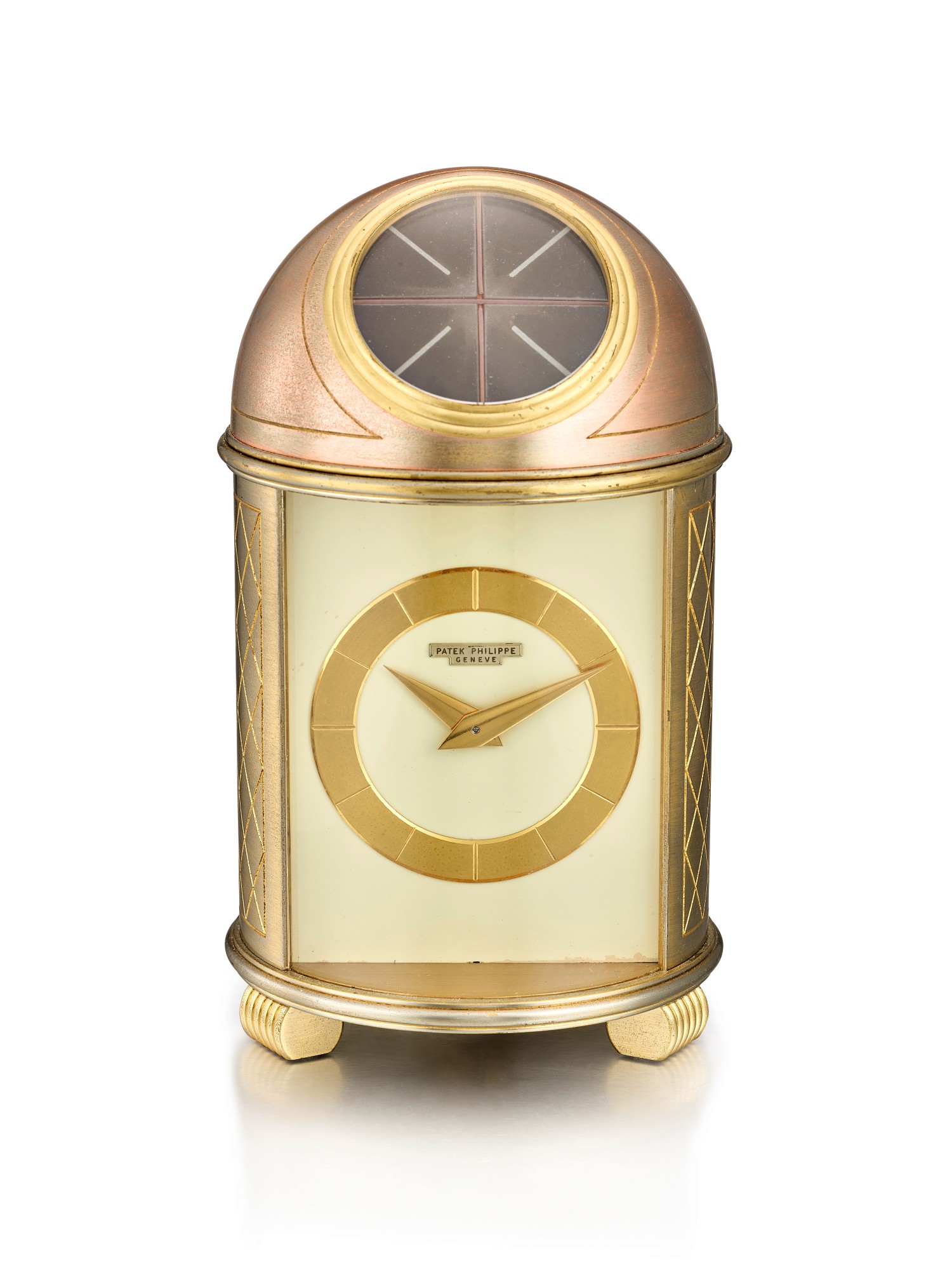 PATEK PHILIPPE REFERENCE 701, A GILT BRASS SOLAR POWERED DOME TABLE