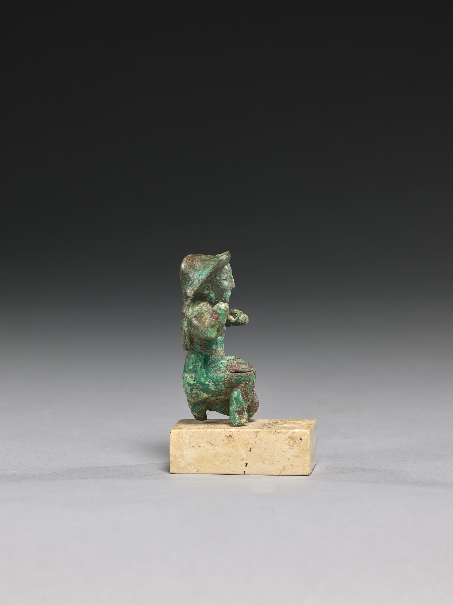 A GREEK BRONZE KNEELING FIGURE, LATE 6TH CENTURY B.C. BC/AD Sculpture
