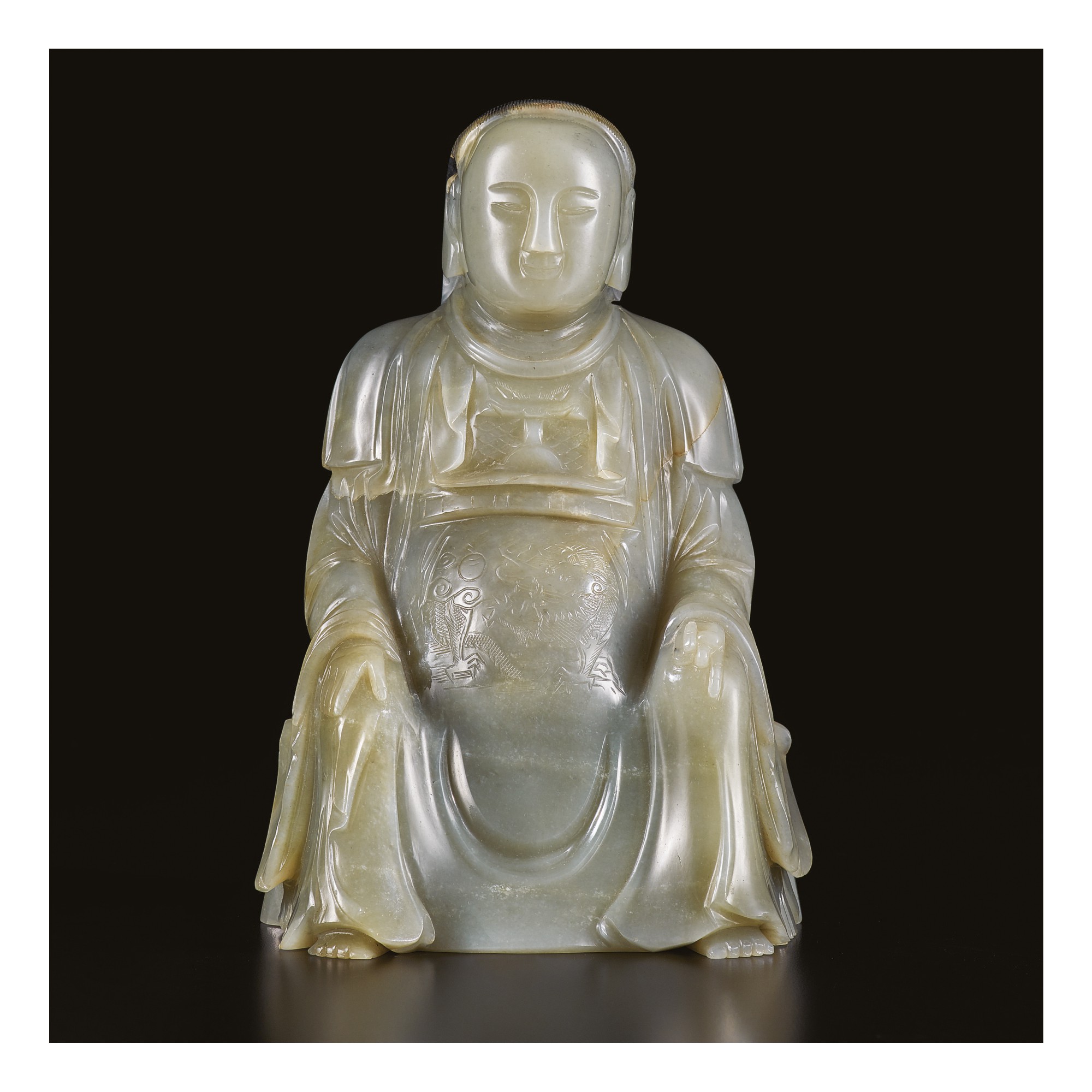 AN EXTREMELY RARE CARVED GREY JADE FIGURE OF ZHENWU, MING DYNASTY