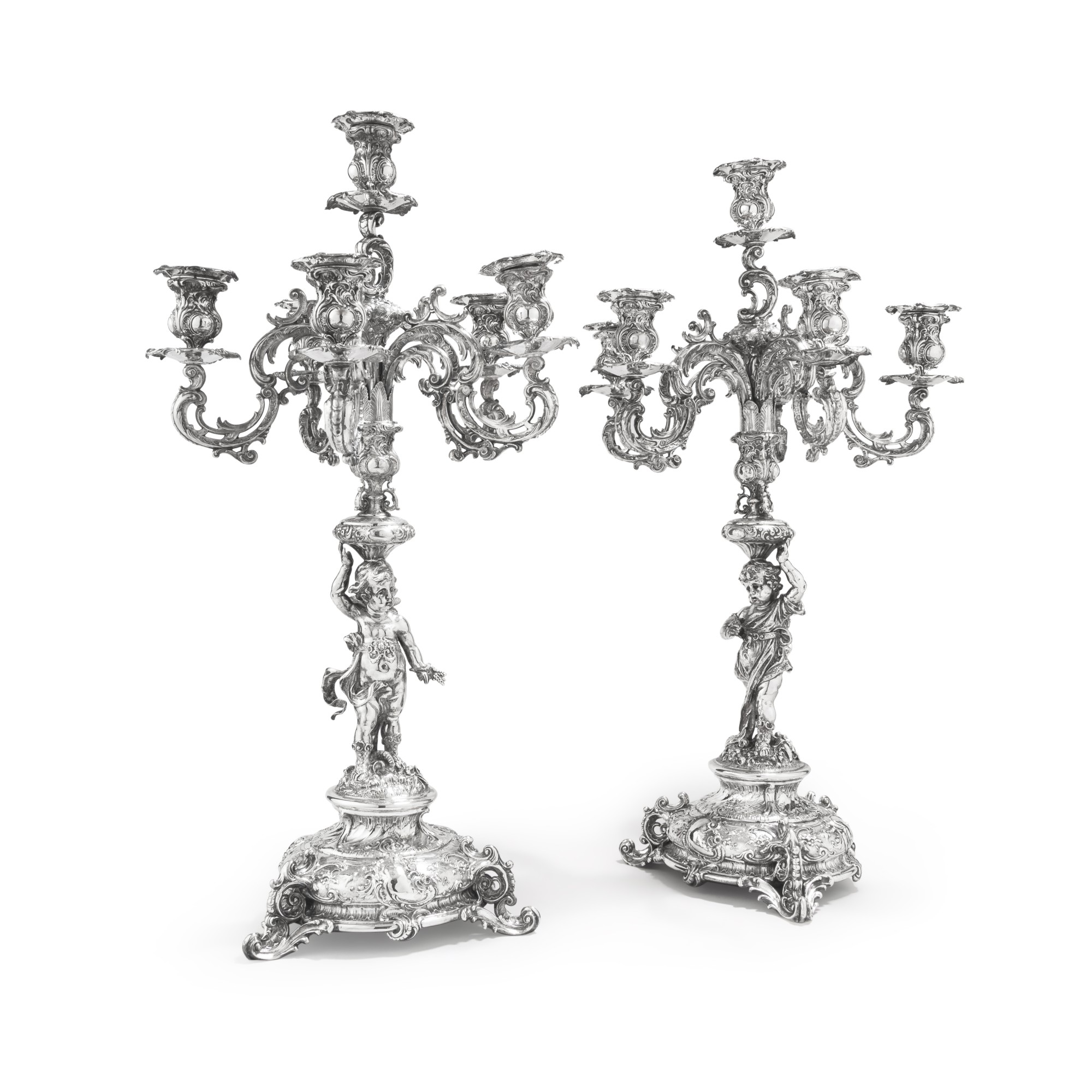 A pair of German Rococo style silver figural six-light candelabra ...