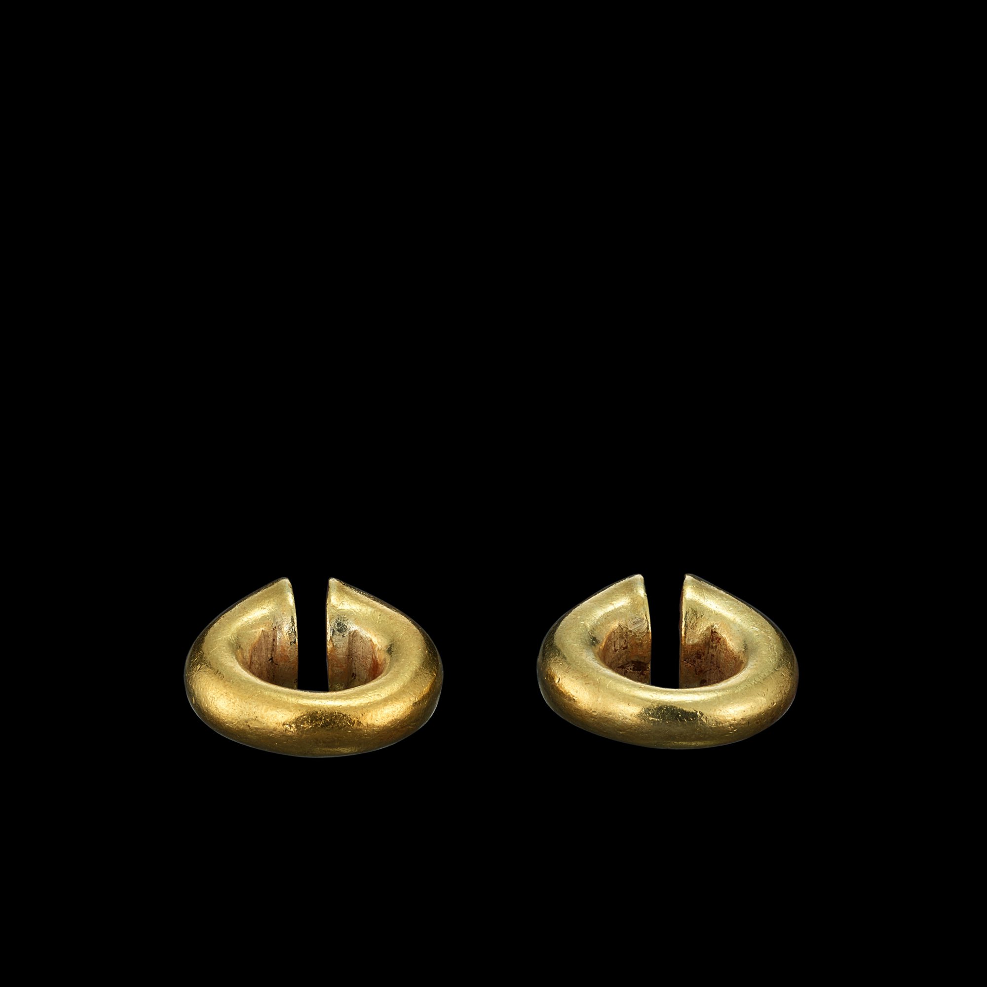 A pair of solid gold earrings Java, Indonesia, 7th - 12th century ...