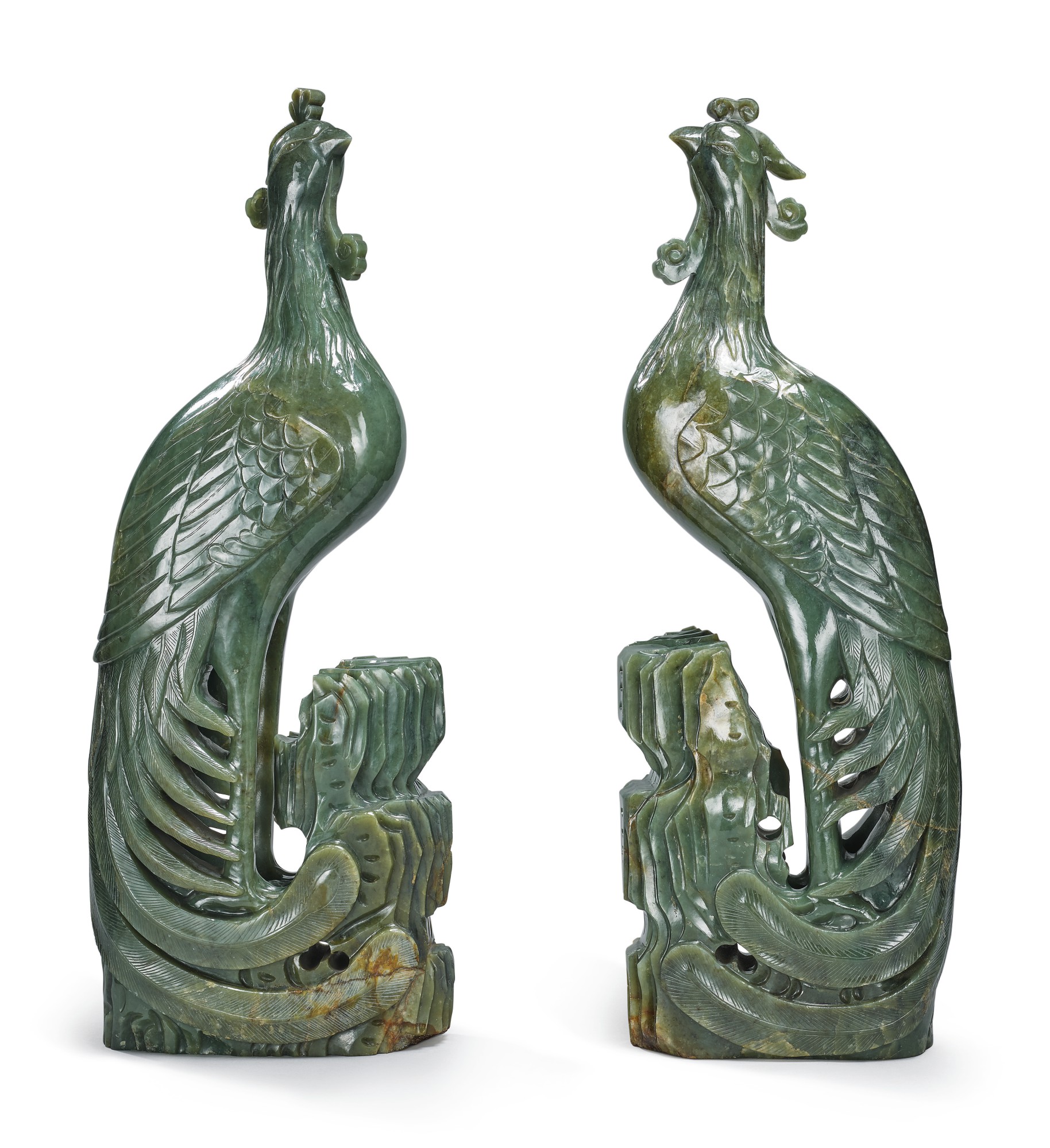 A PAIR OF LARGE SPINACHGREEN JADE FIGURES OF PHOENIXES, 19TH / 20TH