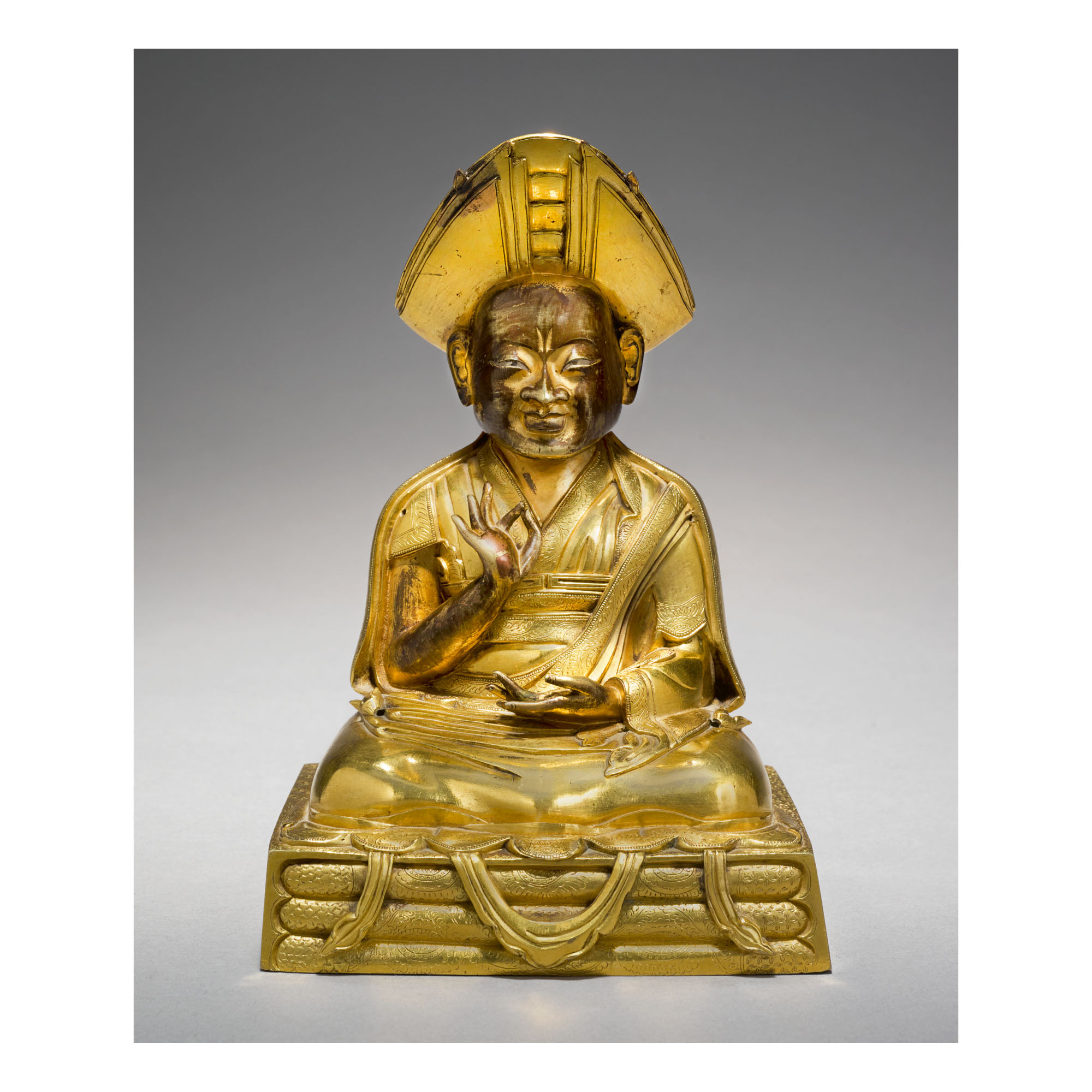 A GILT COPPER ALLOY FIGURE OF CHANGKYA ROLPAI DORJE, TIBET, 18TH