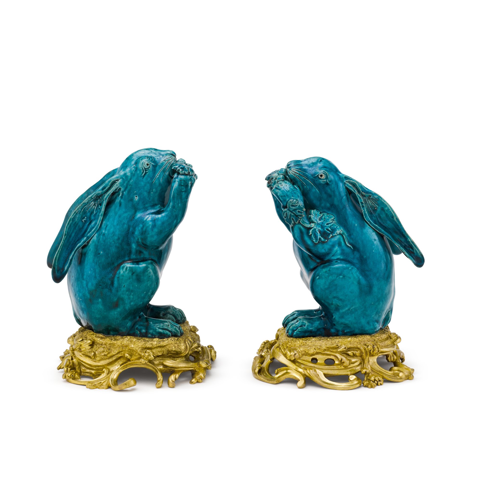 A pair of ormolu-mounted turquoise-glazed figures of rabbits probably ...