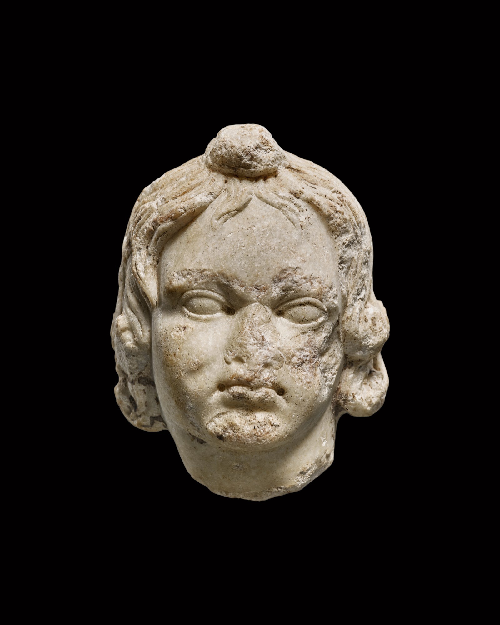 A Roman Marble Head of a Boy or Eros, circa 1st/2nd Century A.D