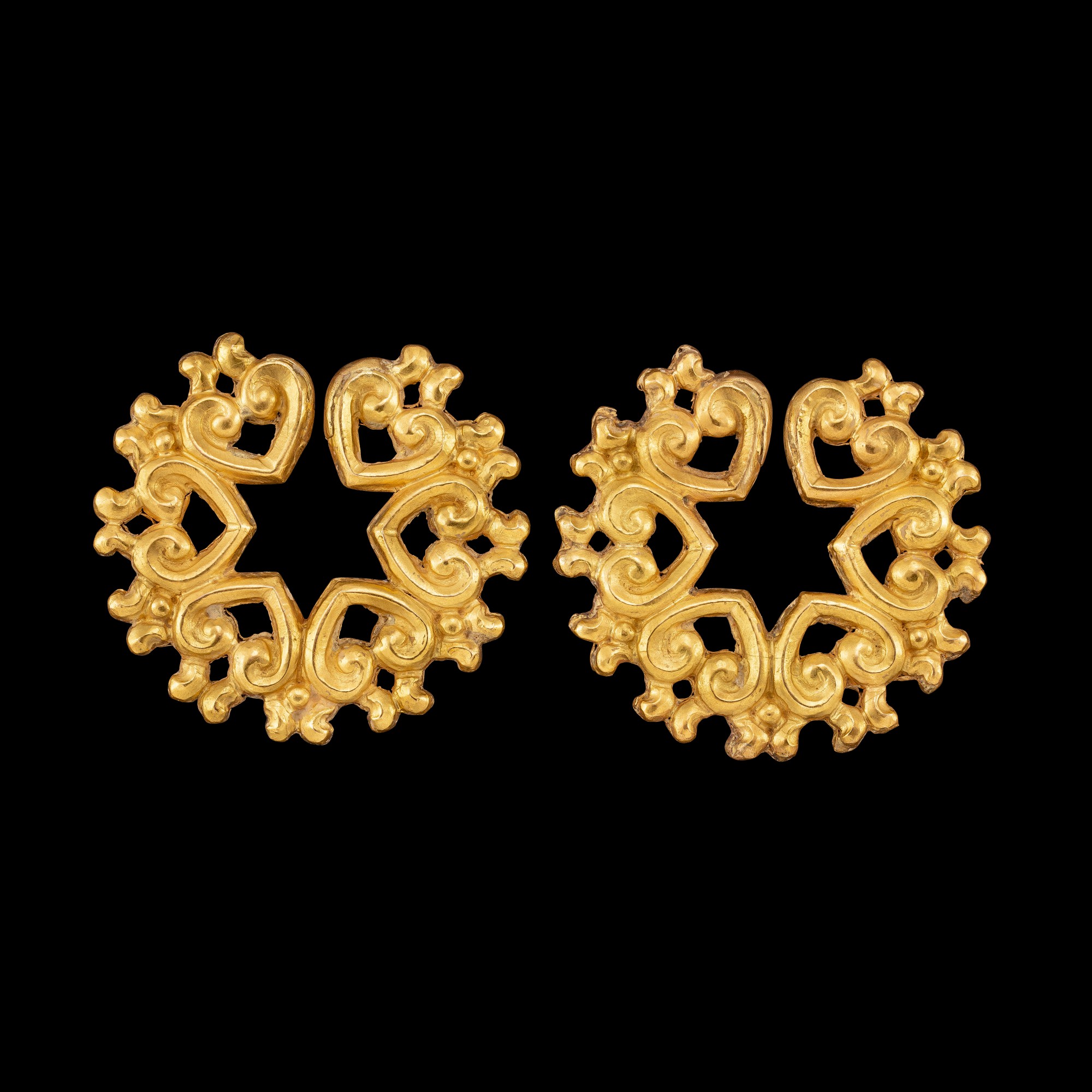 A pair of gold ear ornaments Possibly Java or Indonesian archipelago
