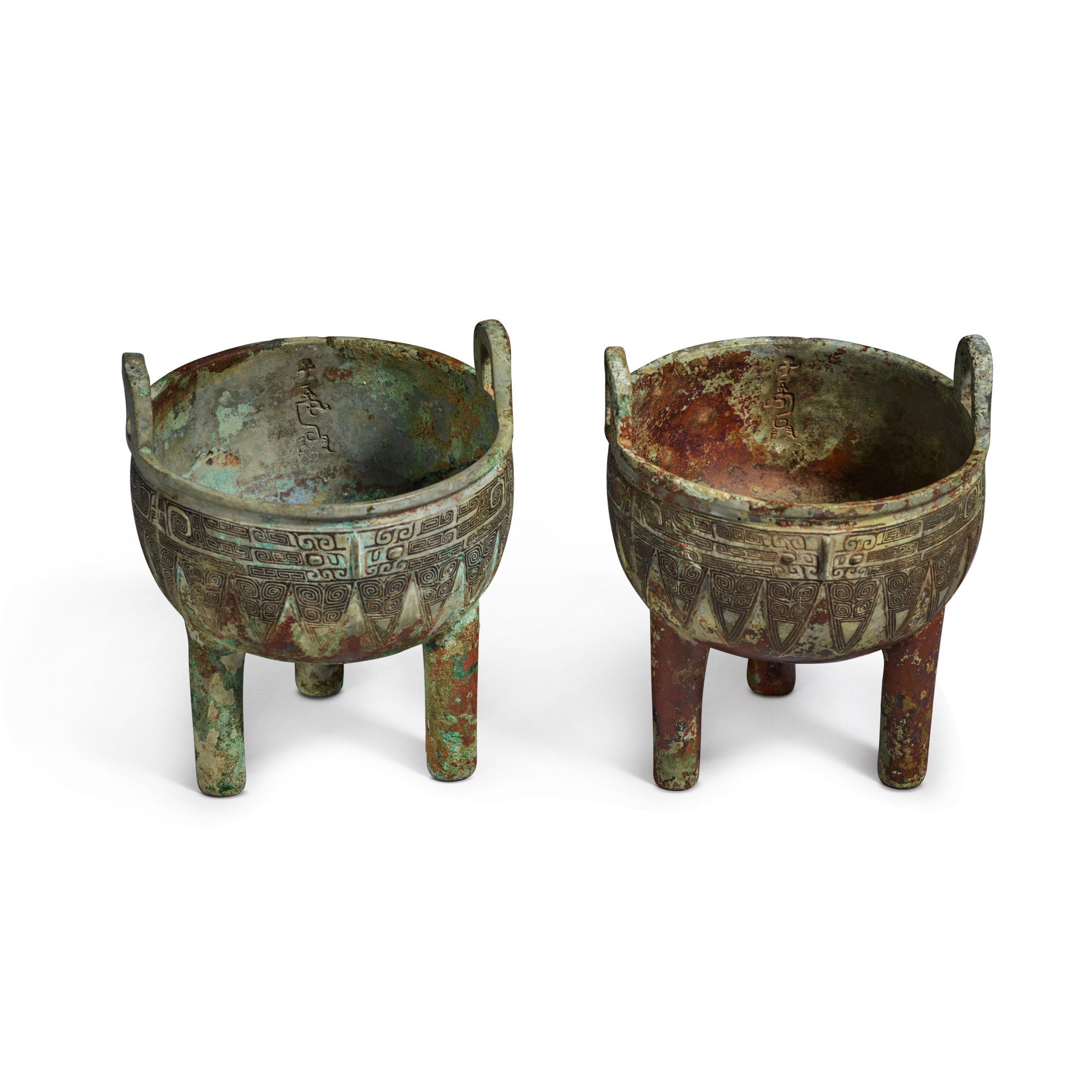 An extremely rare pair of archaic bronze ritual food vessels (Ding ...