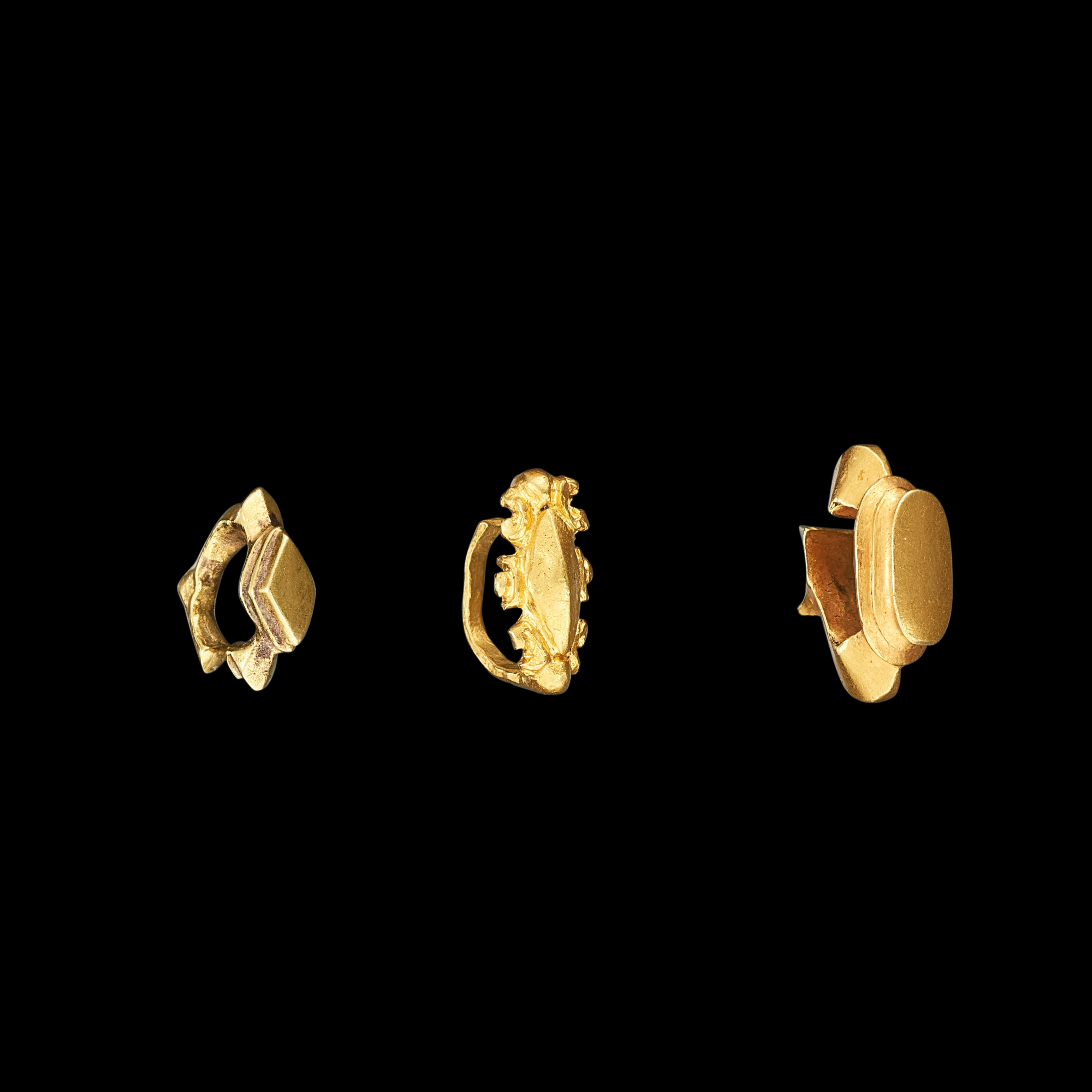 Three solid gold ear ornaments Java, Indonesia, 7th - 12th century ...