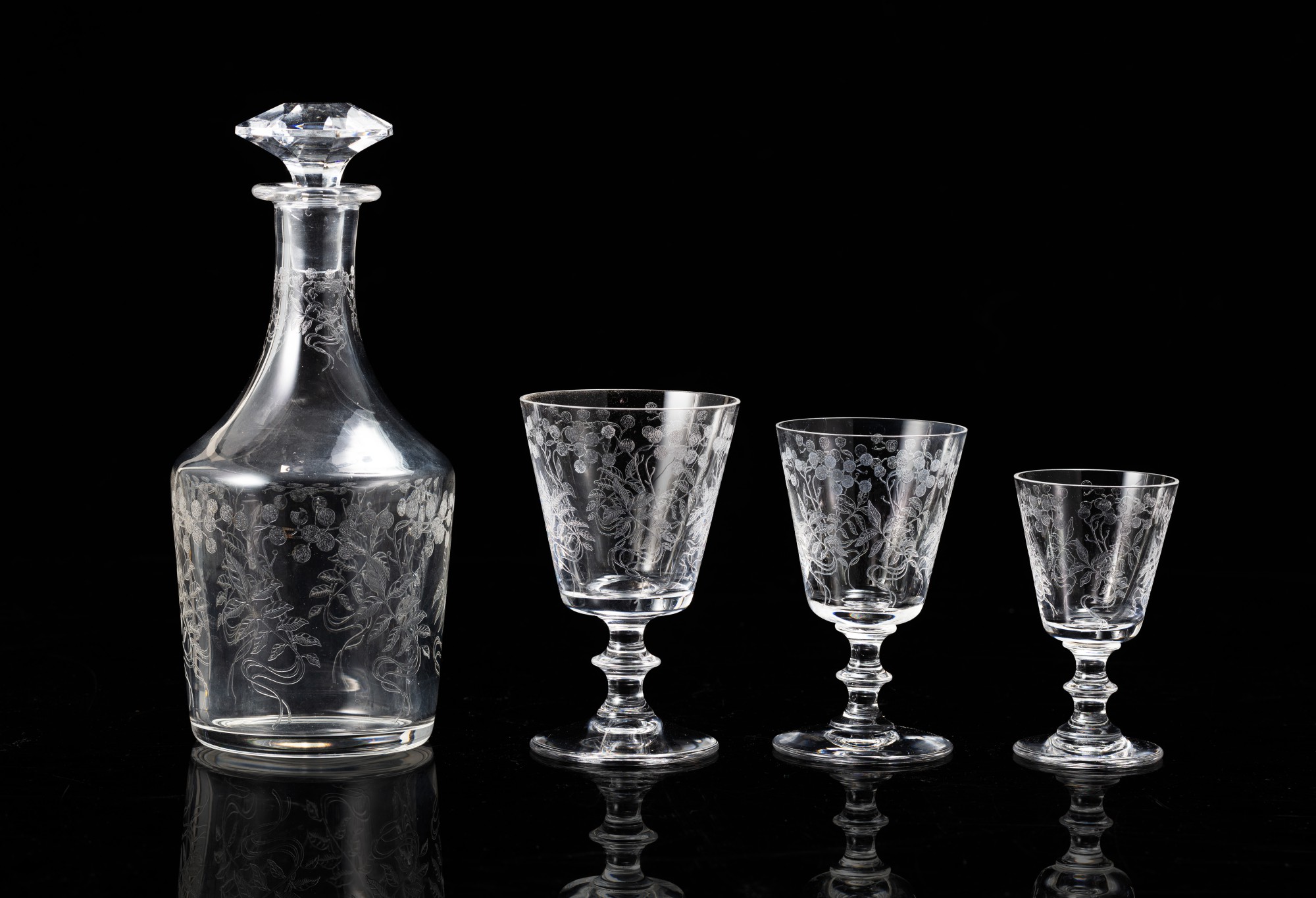 A set of two jugs and thirtytwo cutcrystal glasses, SaintLouis