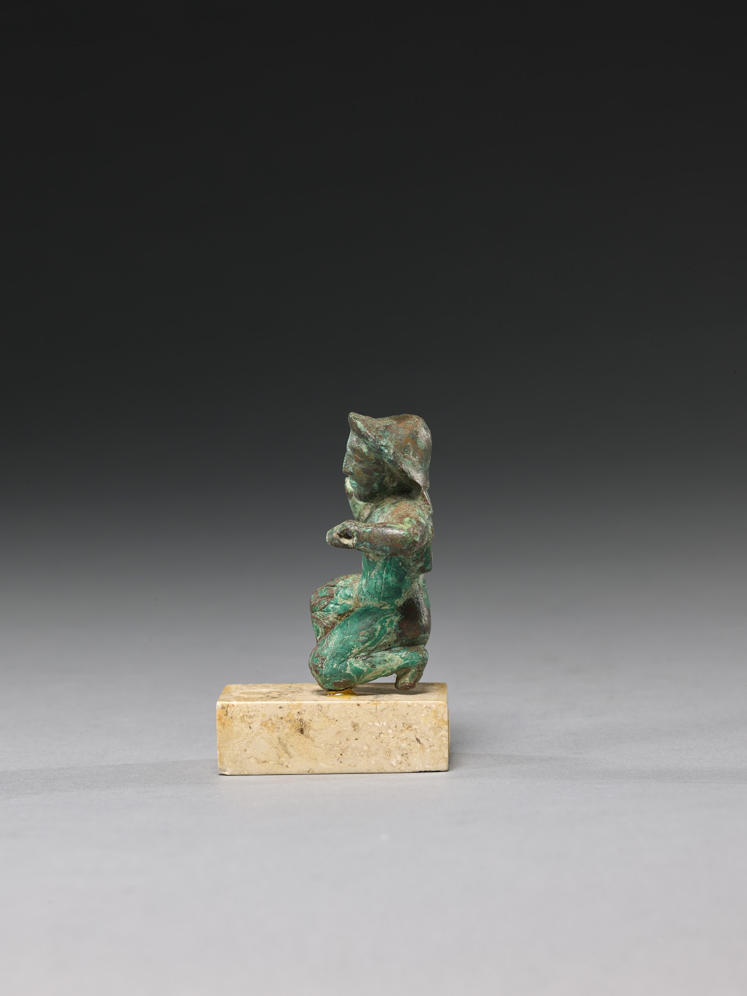 A GREEK BRONZE KNEELING FIGURE, LATE 6TH CENTURY B.C. BC/AD Sculpture
