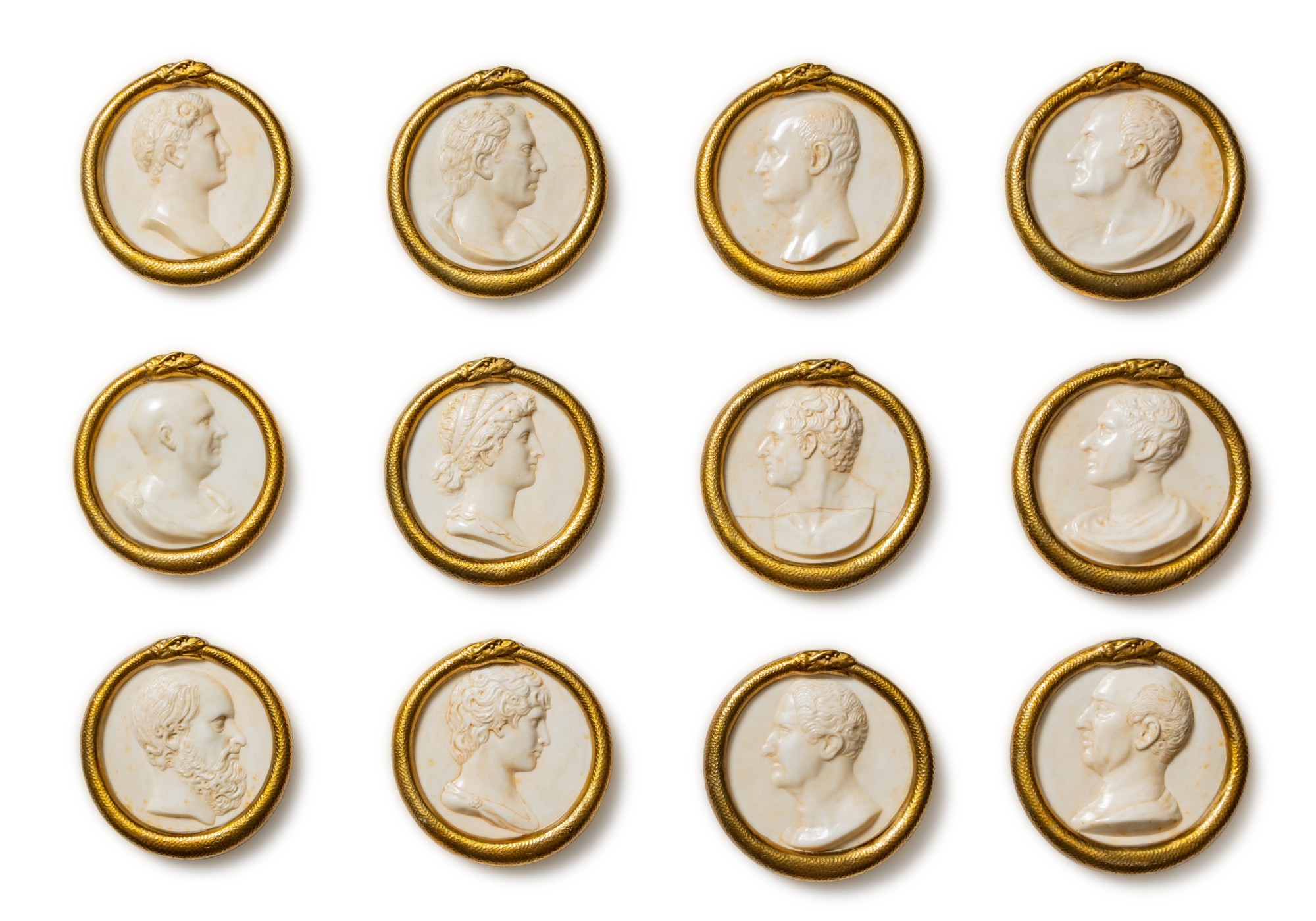 A set of twelve Italian alabaster medallions depicting the Twelve