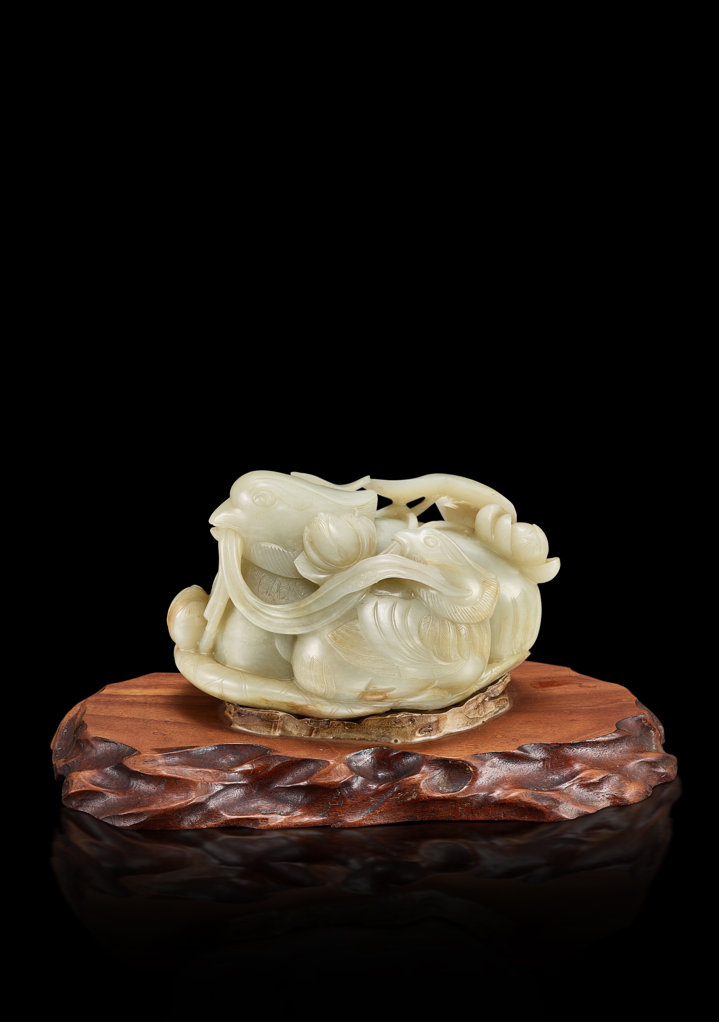 A white jade 'mandarin ducks' group, Qing dynasty, 18th century 清十八世紀