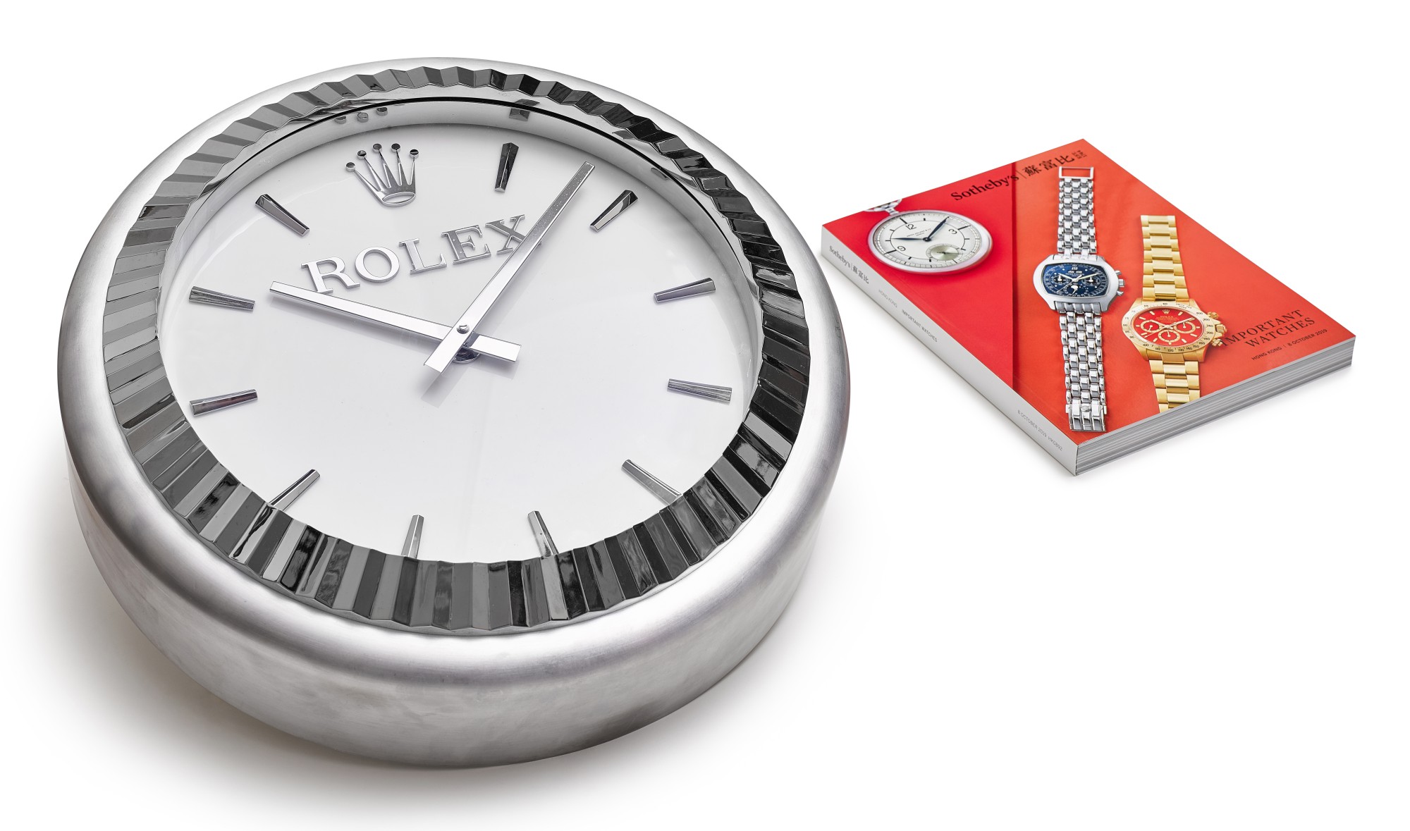 INDUCTA MANUFACTURE FOR ROLEX A METALWORK WALL CLOCK, CIRCA 2010