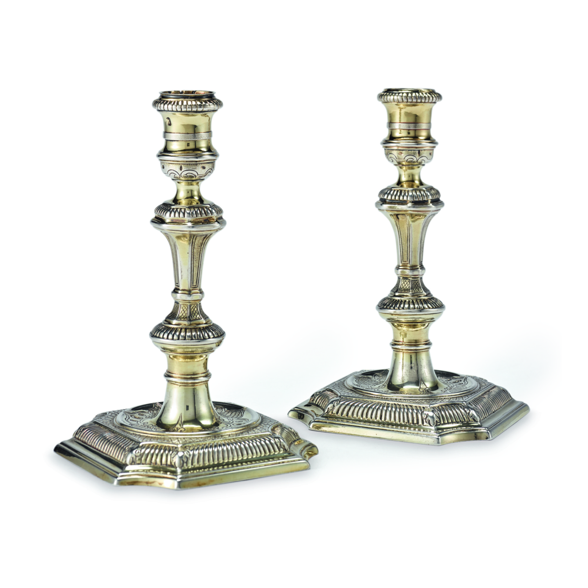 A PAIR OF II SILVERGILT CANDLESTICKS, THOMAS GILPIN, LONDON