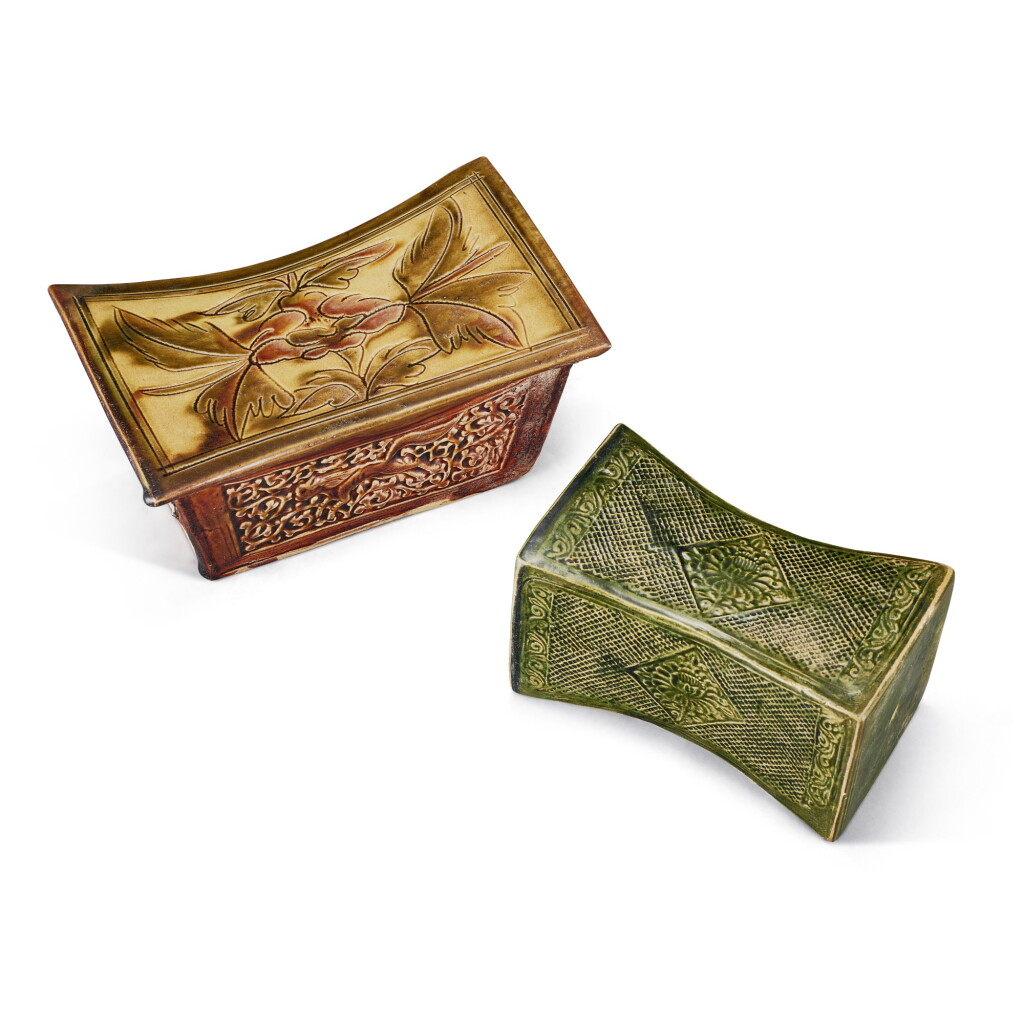 View full screen - View 1 of Lot 336. A sancai carved 'peony' pillow and a Henan green-glazed moulded 'diaper' pillow, Northern Song dynasty 北宋 三彩劃牡丹印獸紋元寶形枕 及河南綠釉印錦地開光花卉紋亞腰長方枕.