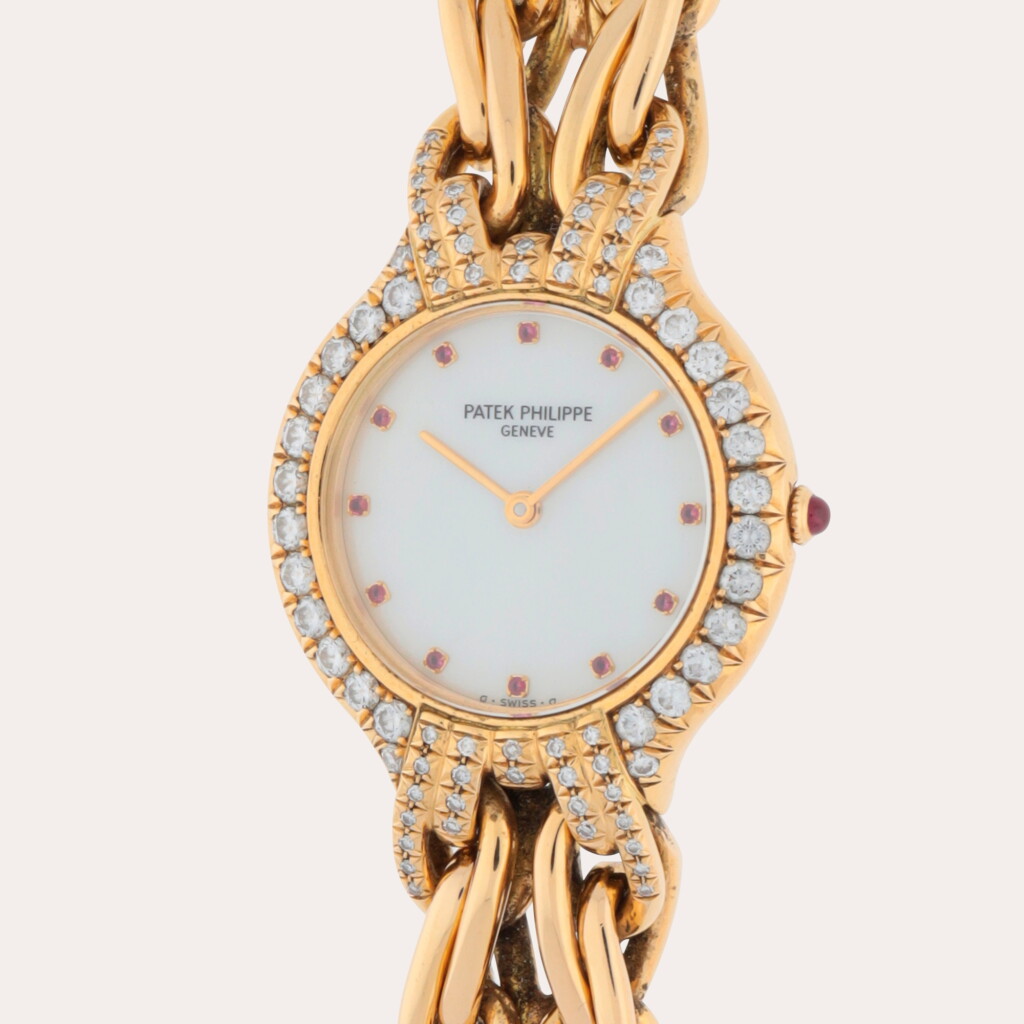 View full screen - View 1 of Lot 298. La Flamme, Reference 4836/003J | A yellow gold and diamond-set bracelet watch with mother-of-pearl ruby-set dial | Circa 1995.