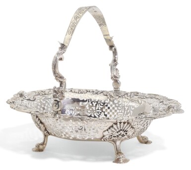 View full screen - View 1 of Lot 219. A GEORGE III IRISH SILVER SWING-HANDLED BASKET, WILLIAM HOMER, DUBLIN, CIRCA 1760.