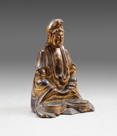 View full screen - View 1 of Lot 128. A gilt-lacquer wood figure of seated Guanyin, 17th-18th century | 十七至十八世紀 漆金木雕觀音坐像.