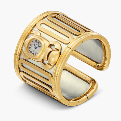 View full screen - View 1 of Lot 123. ‘Tanis’ | A yellow gold and stainless steel cuff watch | Circa 1990.