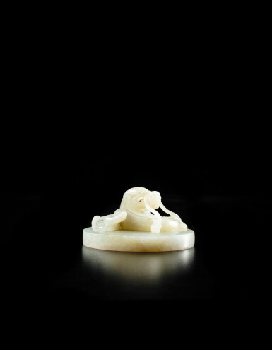 View full screen - View 1 of Lot 1. An important imperial white jade circular 'Jiaqing' seal, Qing dynasty, Jiaqing period | 清嘉慶 御製白玉龍紐璽.