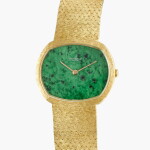 A yellow gold bracelet watch with green hardstone dial | Circa 1970