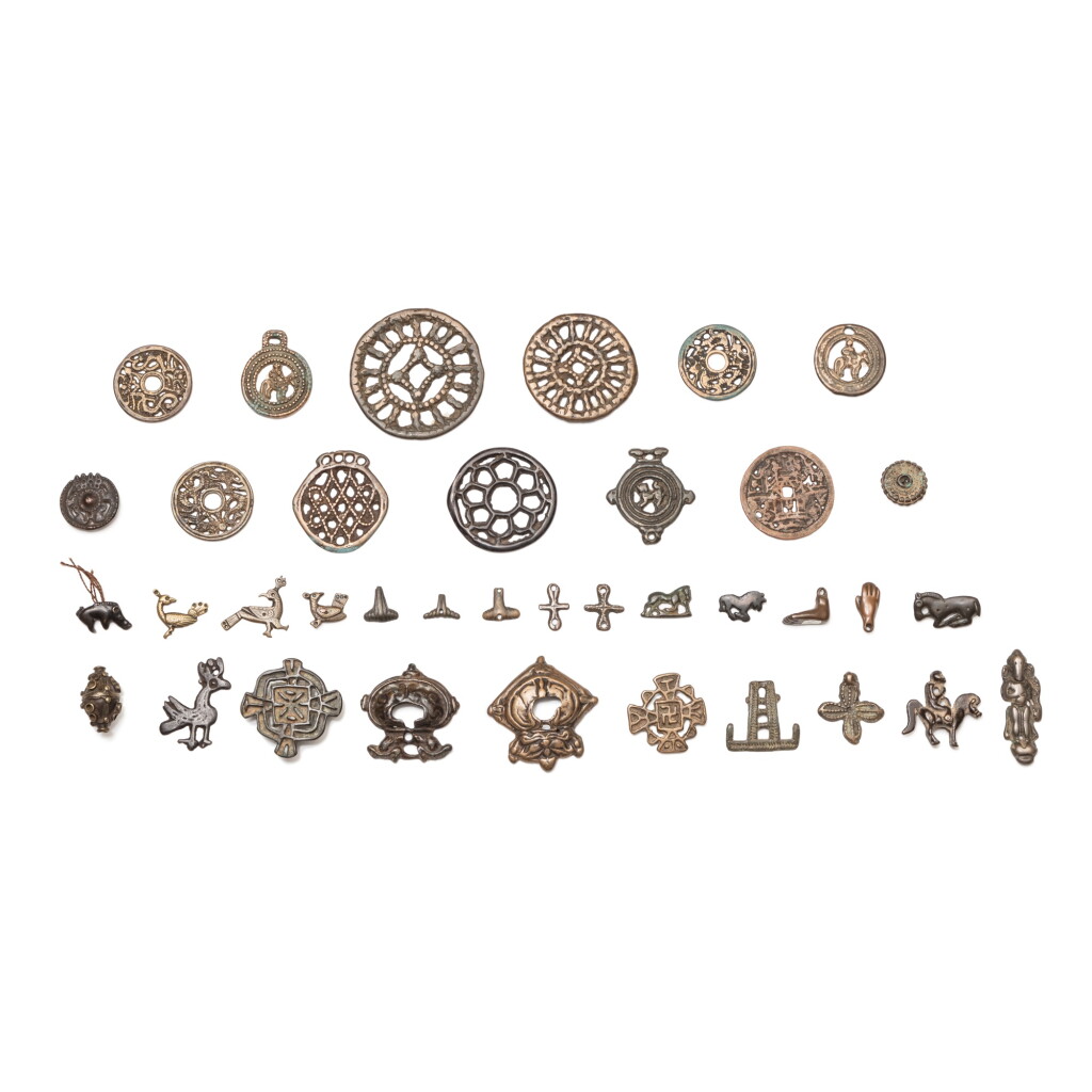 View full screen - View 1 of Lot 44. A study collection of thirty-seven ornaments, Thokcha, Tibet and other Himalayan regions, 8th/14th century | 西藏及喜馬拉雅其他地區 八至十四世紀 托查一組三十七件.