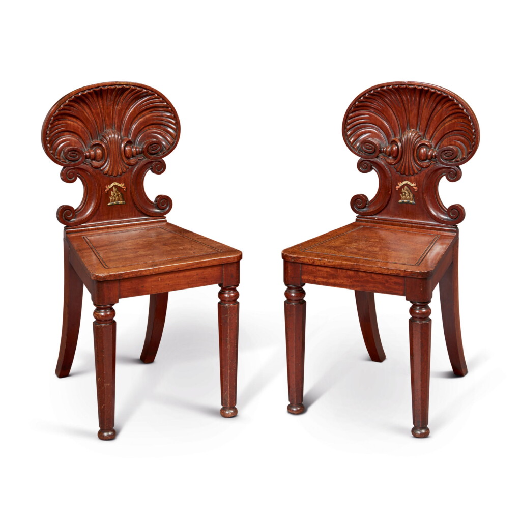 View full screen - View 1 of Lot 629. A PAIR OF GEORGE IV MAHOGANY HALL CHAIRS, POSSIBLY BY GILLOWS, RETAILED BY JAMES WINTER, SOHO, CIRCA 1825.