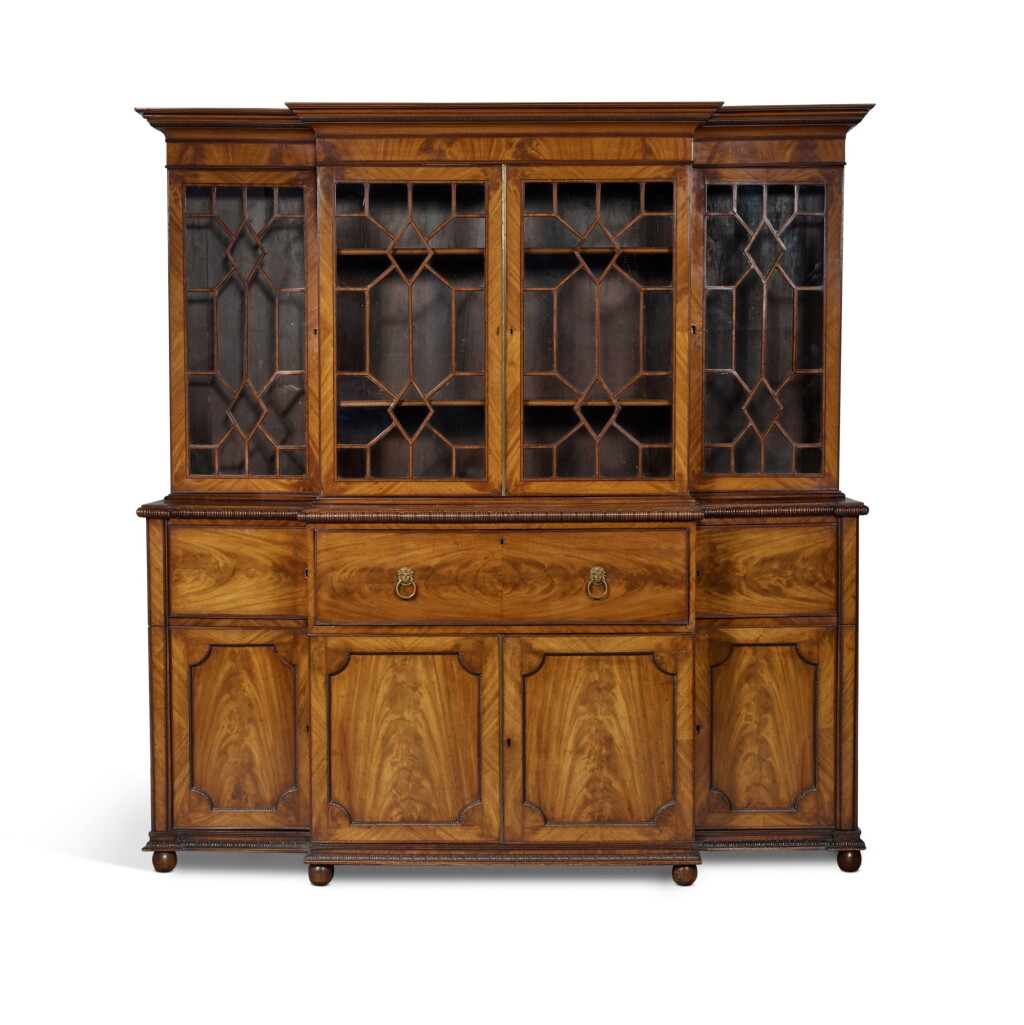 View full screen - View 1 of Lot 14. A Large George III Brass-Mounted Inlaid Mahogany Breakfront Bureau Bookcase, Late 18th Century.