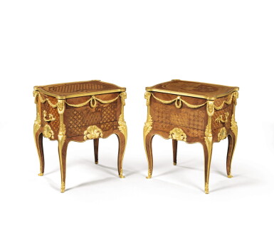 View full screen - View 1 of Lot 180. A near pair of French transitional-style tulipwood and mahogany parquetry cabinets, after the model by J.F. Oeben, late 19th century.