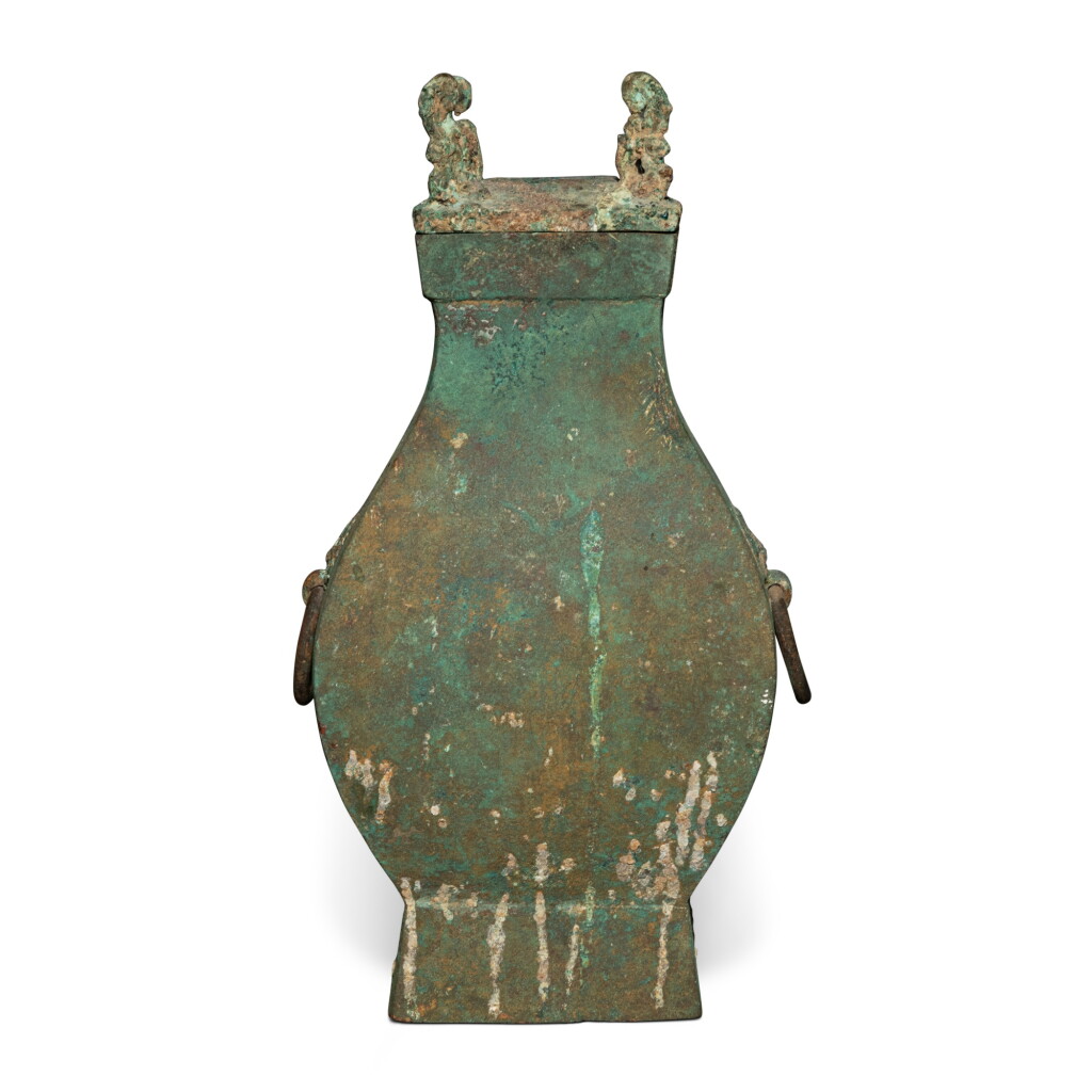 View full screen - View 1 of Lot 875. An archaic bronze vase and cover (Fanghu), Han dynasty | 漢 青銅方壺.