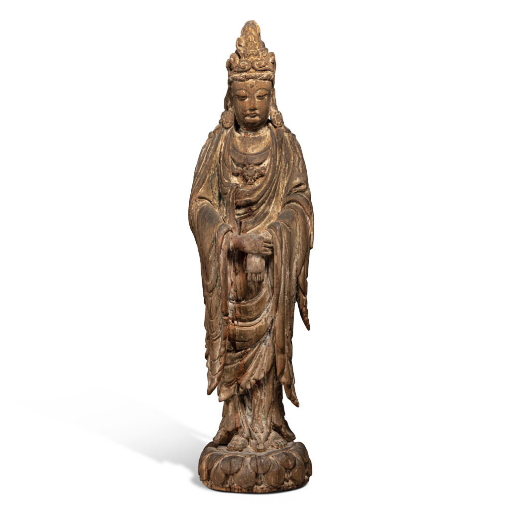 View full screen - View 1 of Lot 203. A carved and polychrome wood figure of Guanyin, Jin / Yuan dynasty | 金 / 元 木雕加彩觀音立像.