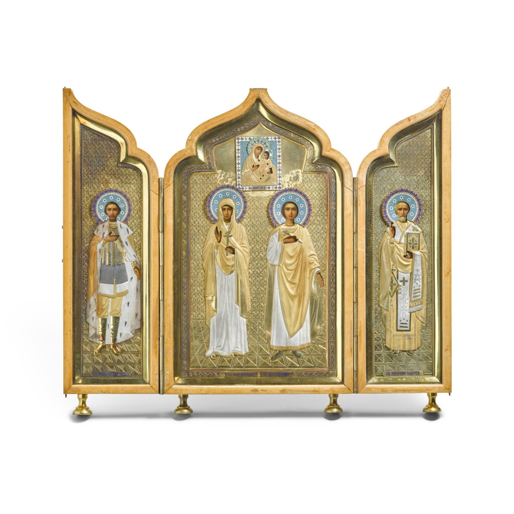 View full screen - View 1 of Lot 335. A Russian gilt-metal and cloisonné and champlevé enamel triptych icon, late 19th to early 20th century.