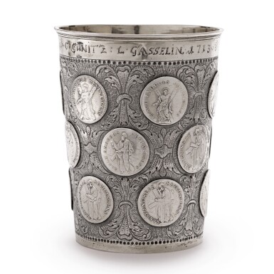 View full screen - View 1 of Lot 205. A GERMAN PARCEL-GILT SILVER AND COIN-INSET BEAKER, MAKER'S MARK FW, PROBABLY PRUSSIA, DATED 1713.