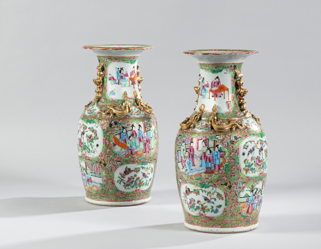 View full screen - View 1 of Lot 54. A pair of Canton famille-rose baluster vases Qing dynasty, 19th century | 清十九世紀 廣東粉彩花卉人物紋雙耳瓶一對.