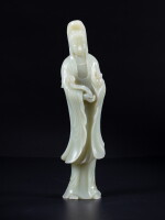 A pale celadon jade figure of Guanyin, Qing dynasty, circa 1900