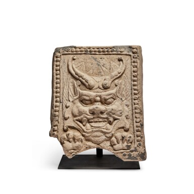 View full screen - View 1 of Lot 238. A rare molded gray pottery 'beast mask' tile, Six Dynasties.
