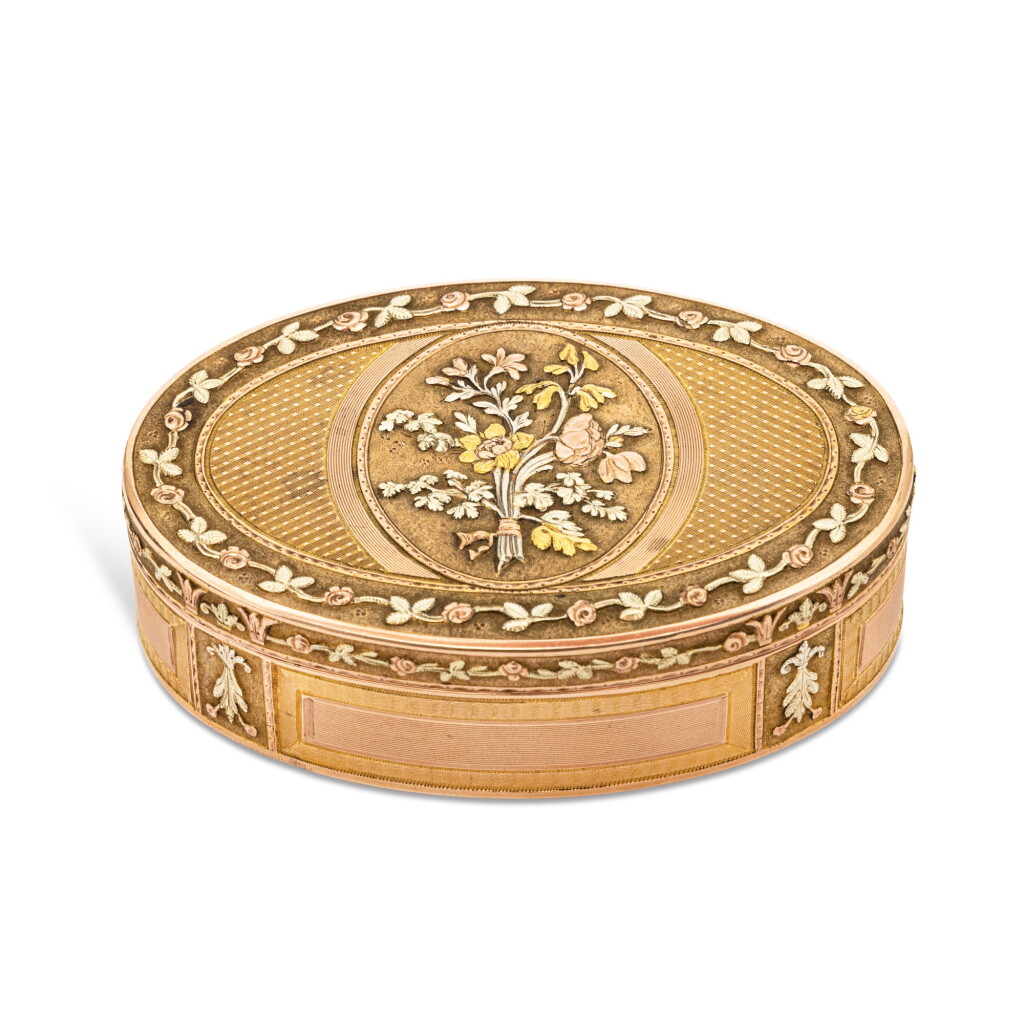 View full screen - View 1 of Lot 88. A German Vari-Color Gold Oval Snuff Box, Maker's Mark a Circular Flowerhead, Probably Hanau, Circa 1790.