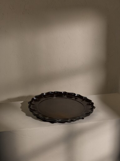 View full screen - View 1 of Lot 218. A rare large dark brown lacquer barbed charger, Ming dynasty, 15th century | 明十五世紀 褐漆菱口大盤.
