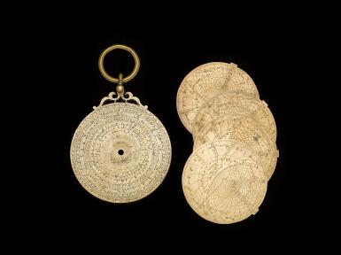 View full screen - View 1 of Lot 508. An Almohad brass astrolabe mater and plates, signed by Abu Bakr ibn Yusuf, Morocco, Marrakesh, dated 615 AH/1218-19 AD.
