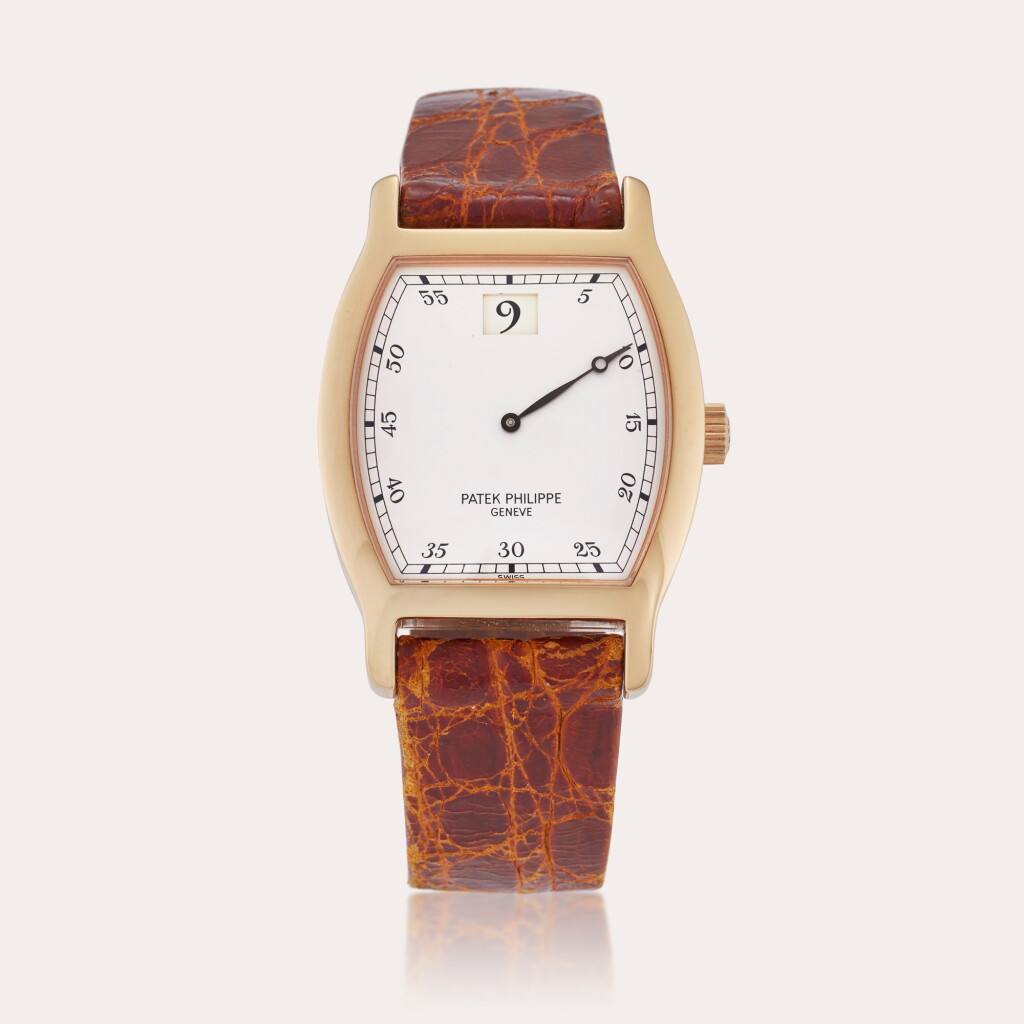 View full screen - View 1 of Lot 19. Reference 3969R Jump Hour | A limited edition pink gold tonneau shaped jump hour wristwatch, Made to commemorate the 150th Anniversary of Patek Philippe, Made in 1989.
