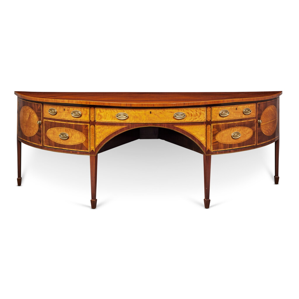 View full screen - View 1 of Lot 368. A George III Mahogany Inlaid Satinwood and Tulipwood Crossbanded Sideboard, Circa 1790.